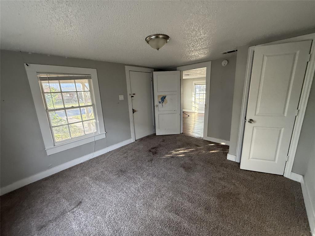 402 West 4th Street, Unit 1 Kaufman, TX 75142 - Photo 9 of 18 a view of livingroom with hardwood floor and window