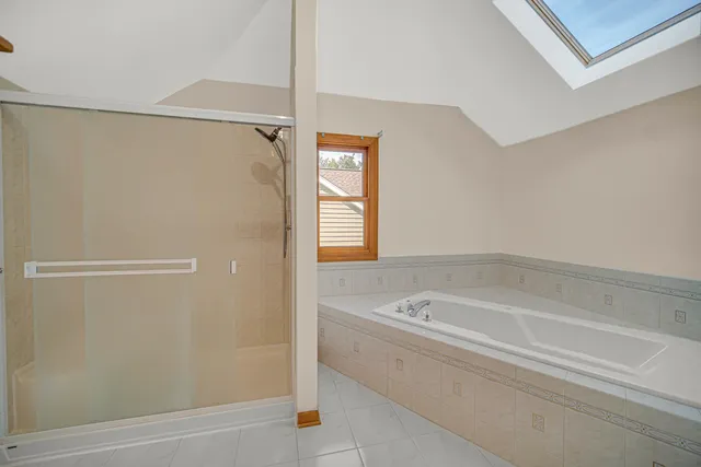 a bathroom with a bathtub and a shower