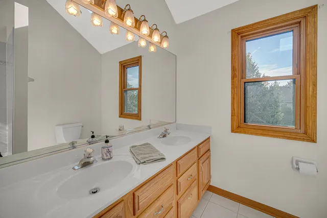 a bathroom with a sink a vanity and a mirror