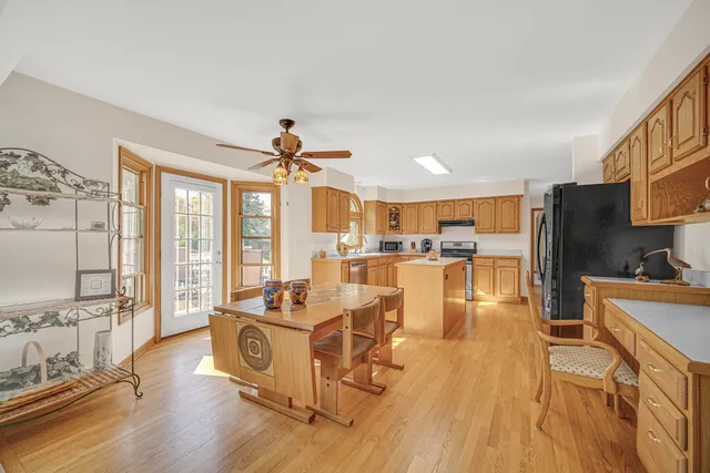a living room with furniture wooden floor and a large window