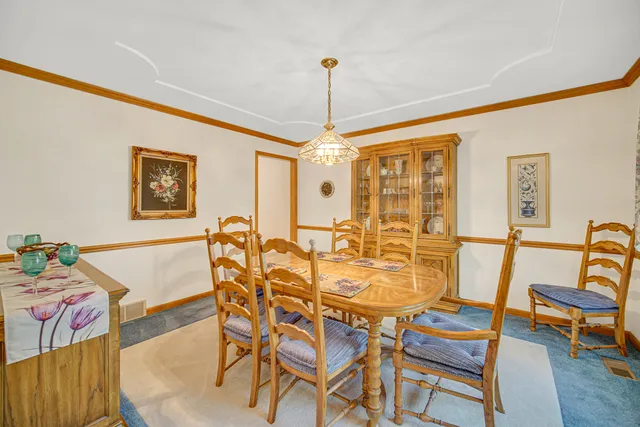 a dining room with furniture and window