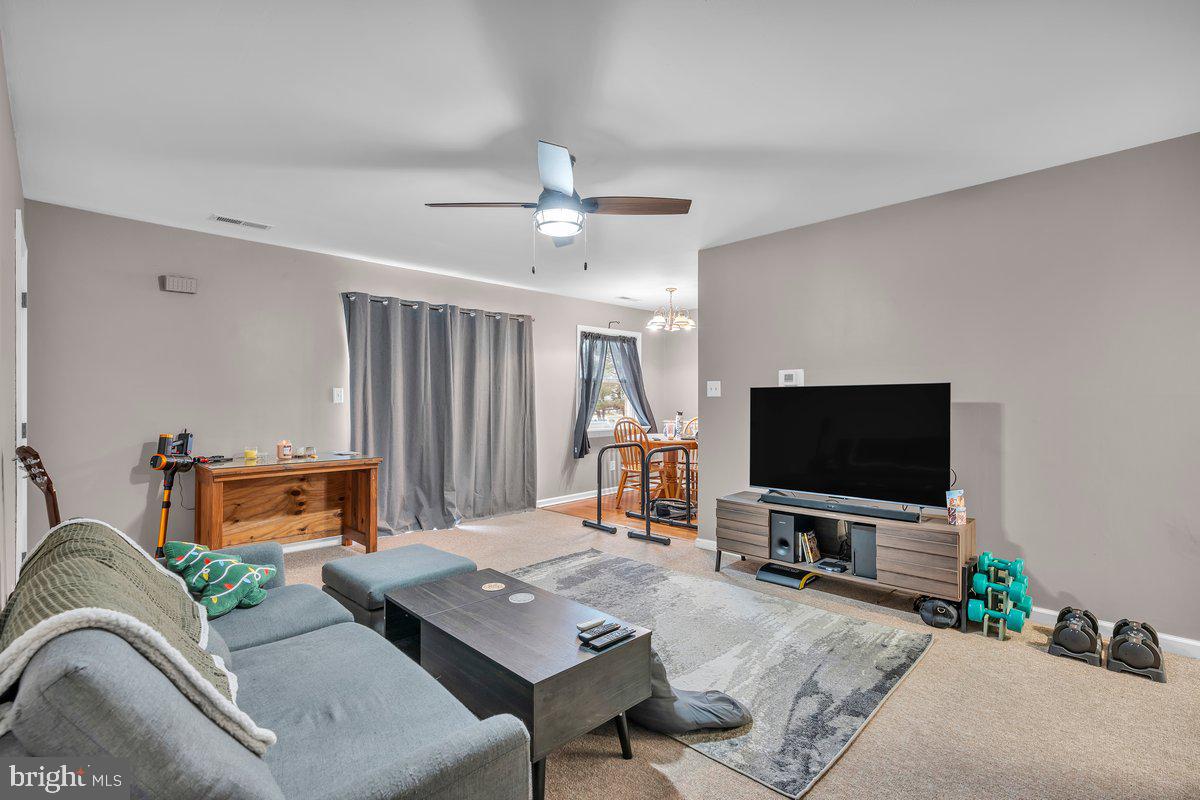 702 Winding Way Westville, NJ 08093 - Photo 11 of 22 a living room with furniture and a flat screen tv