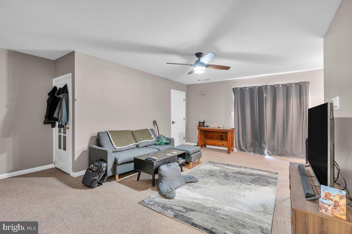 702 Winding Way Westville, NJ 08093 - Photo 13 of 22 a workspace with furniture and a flat screen tv