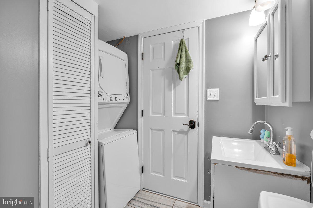 702 Winding Way Westville, NJ 08093 - Photo 14 of 22 a bathroom with a sink and a mirror