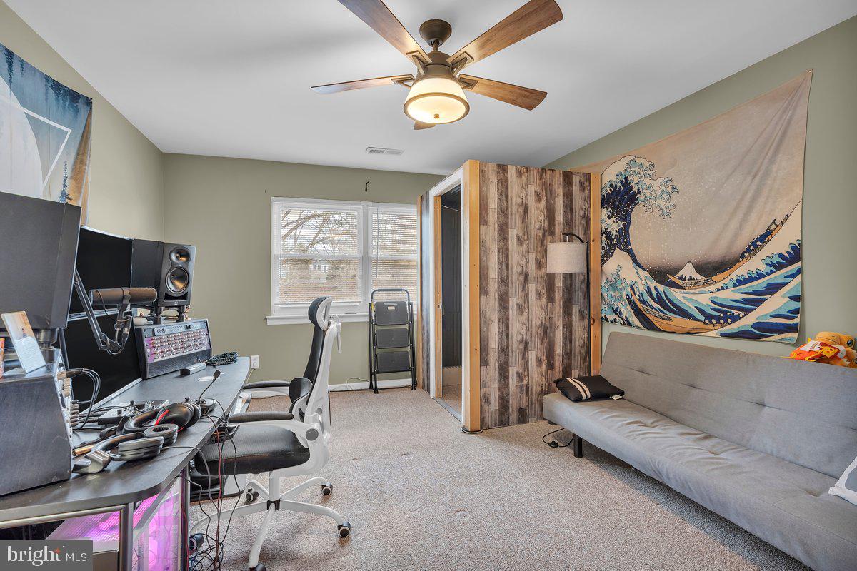 702 Winding Way Westville, NJ 08093 - Photo 20 of 22 a living room with furniture and a flat screen tv