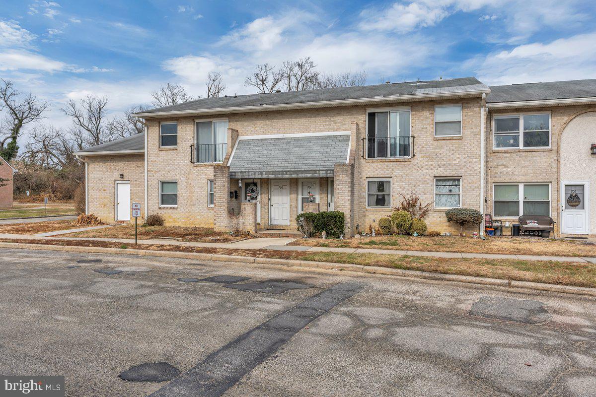 702 Winding Way Westville, NJ 08093 - Photo 2 of 22 a front view of a house with a garden