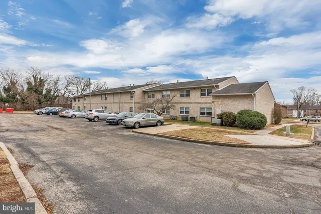 a view of multiple houses with a street