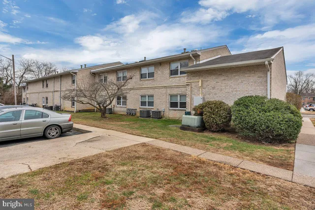 a view of a car parked in front of a house