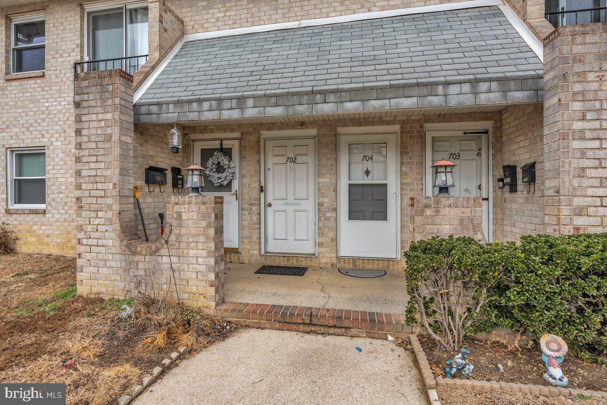 702 Winding Way Westville, NJ 08093 - Photo 4 of 22 a front view of a house with a garden