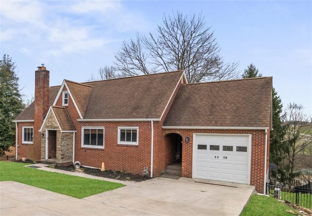 a view of house with yard