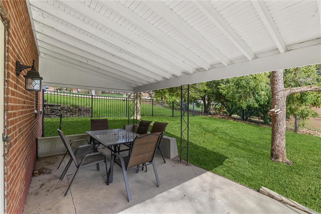 1110 10th Street Irwin, PA 15642 - Photo 34 of 50 a view of a patio with a table chairs and a backyard
