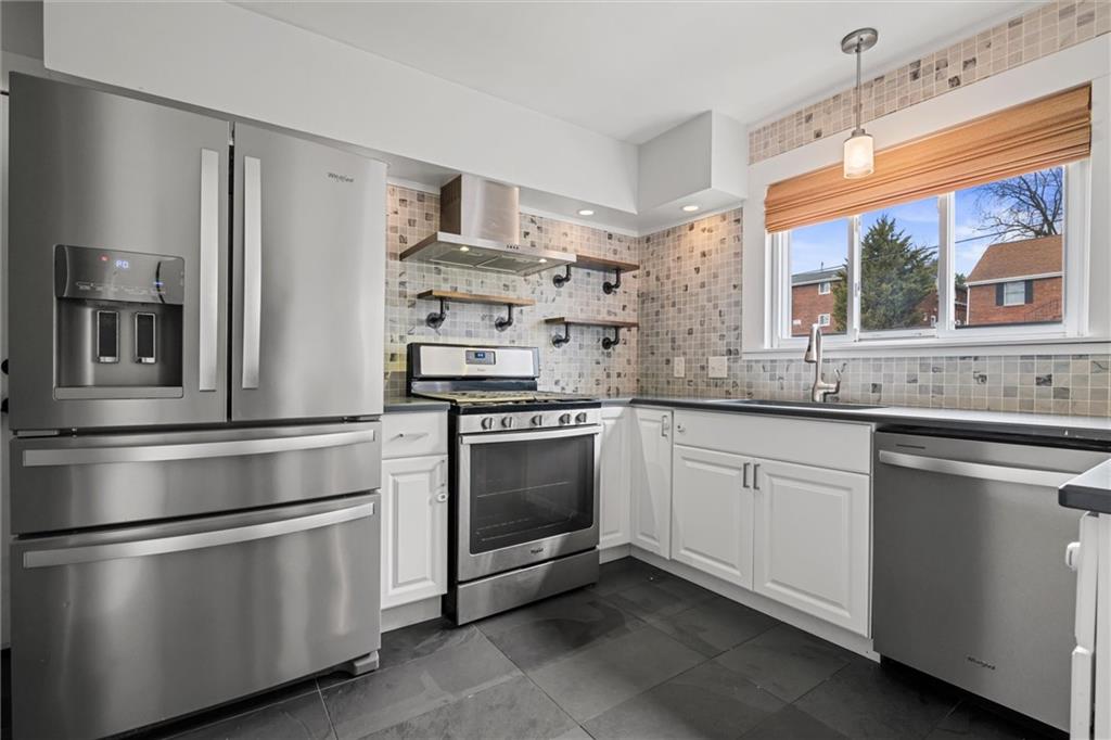 1110 10th Street Irwin, PA 15642 - Photo 4 of 50 a kitchen with granite countertop stainless steel appliances and sink
