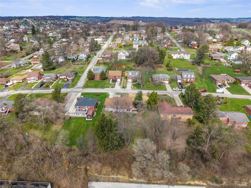 1110 10th Street Irwin, PA 15642 - Photo 46 of 50 an aerial view of residential houses with outdoor space and trees