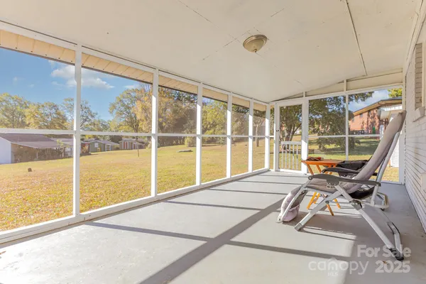 a view of a room with window and stairs