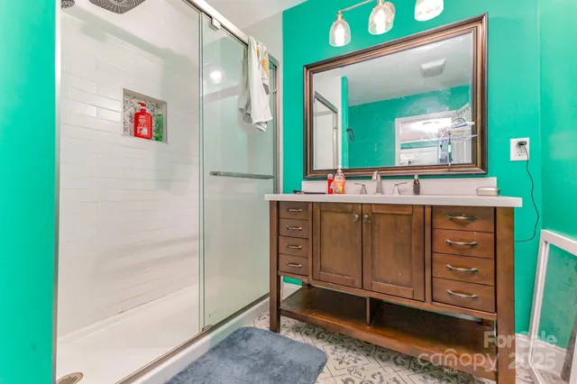 a bathroom with a toilet sink and shower