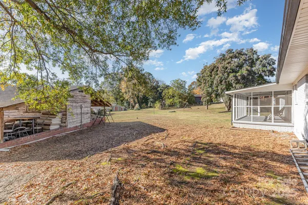 a backyard of a house with lots of green space