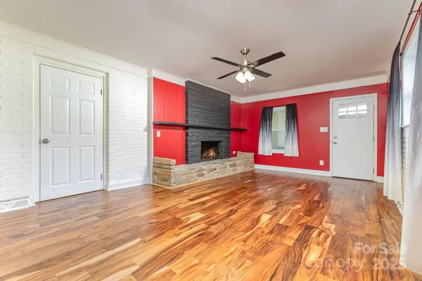 a view of livingroom with hardwood floor and ceiling fan