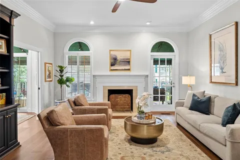 a living room with furniture and a book shelf
