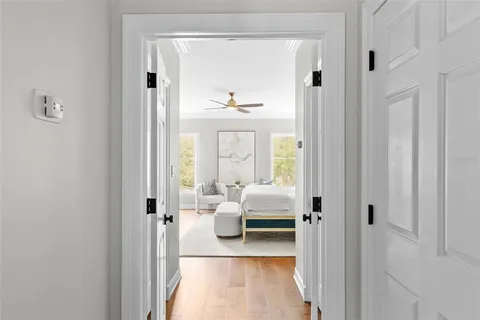 a spacious bedroom with a bed and a couch