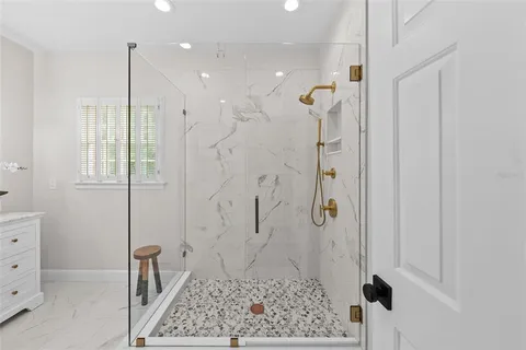 a view of a bathroom with a shower and a toilet