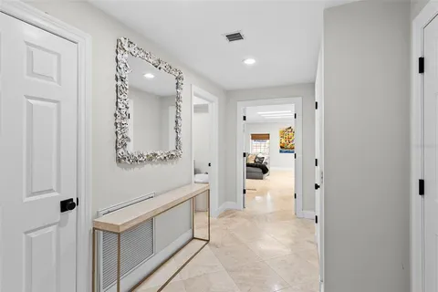 a bathroom with a shower sink vanity and mirror