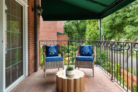 a view of deck with furniture and garden