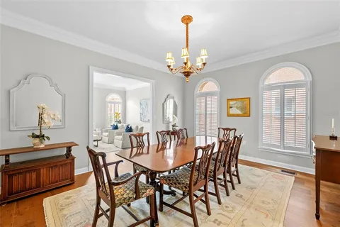 a view of a dining room with furniture and chandelier