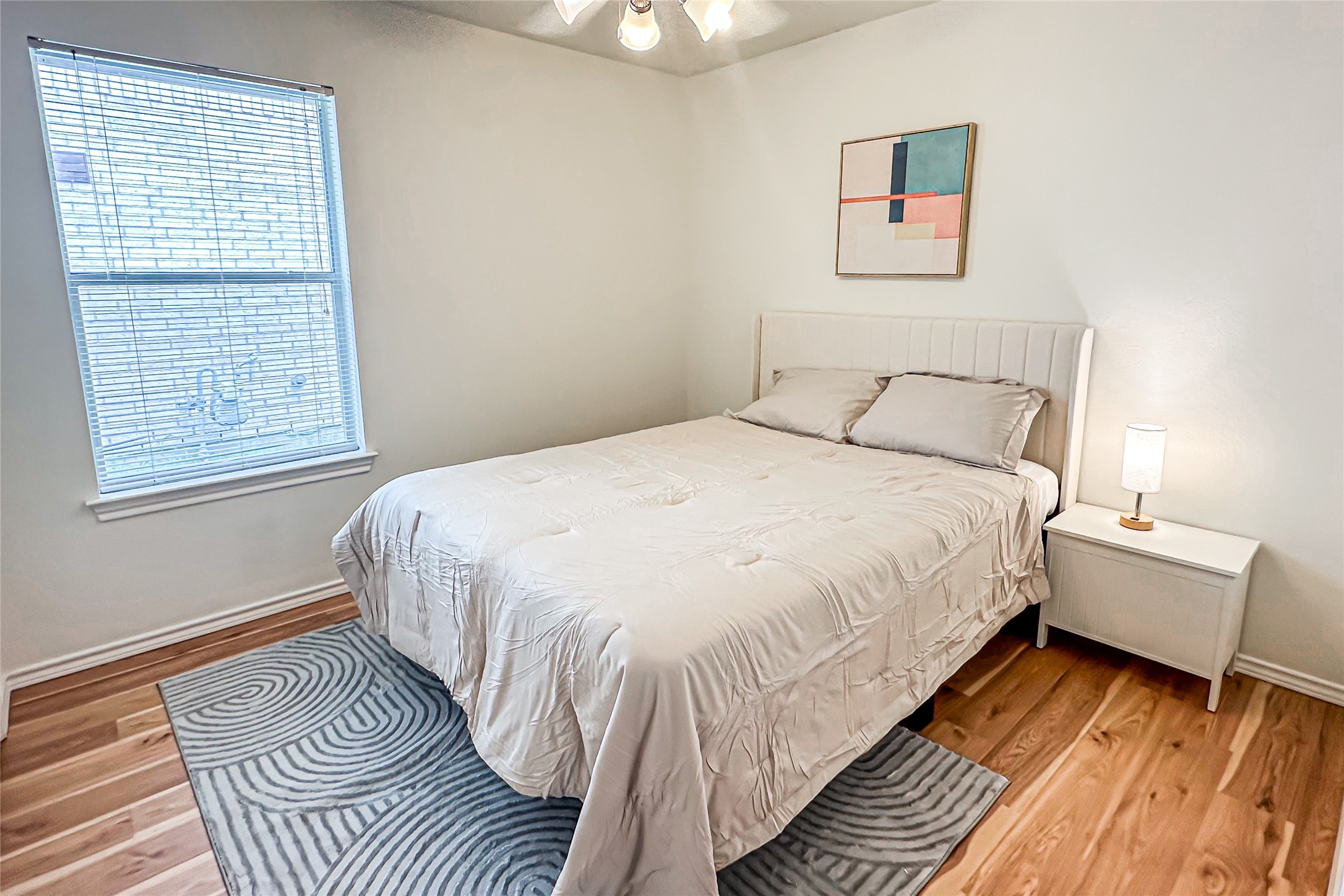 12426 Gershwin Oak Street Houston, TX 77089 - Photo 5 of 12 a spacious bedroom with a bed and a window