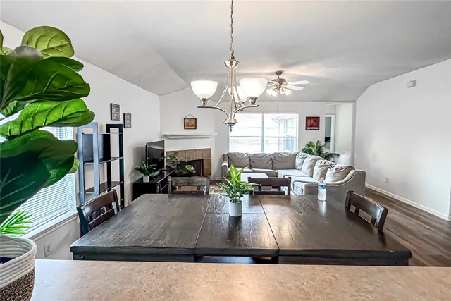 a living room with kitchen island furniture and a fireplace