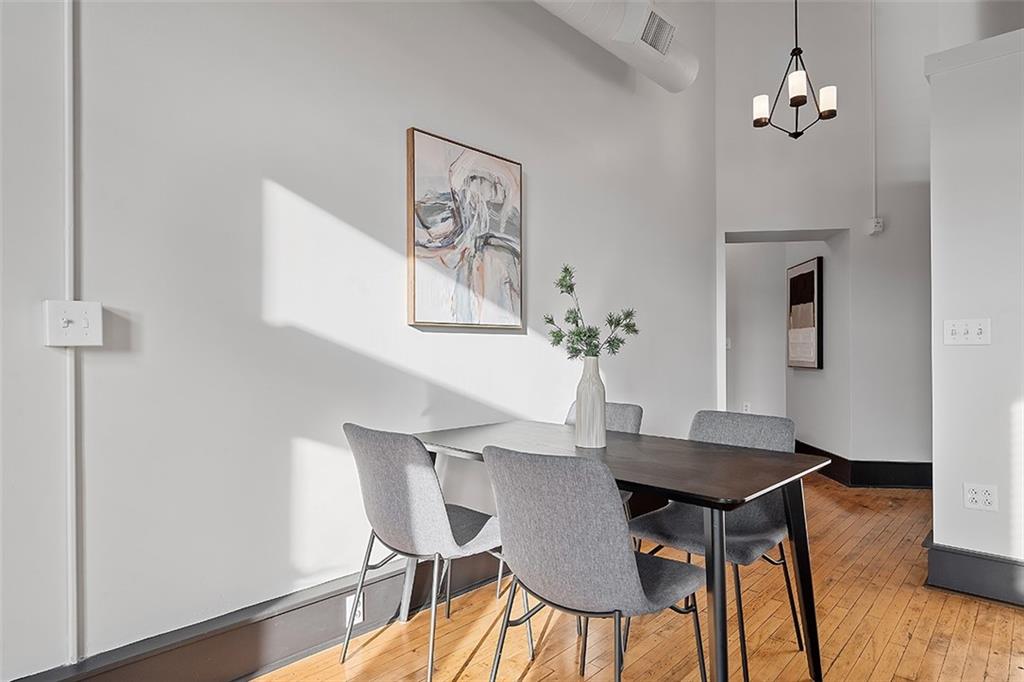 3080 Smallman Street Pittsburgh, PA 15201 - Photo 20 of 48 a view of a dining room with furniture and wooden floor