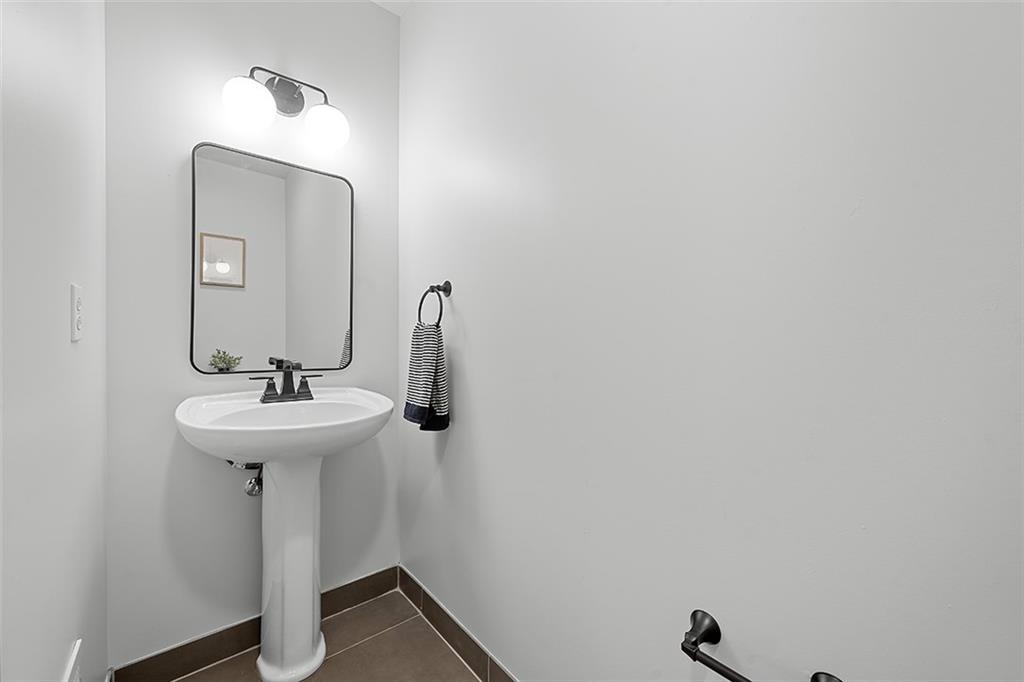 3080 Smallman Street Pittsburgh, PA 15201 - Photo 22 of 48 a bathroom with a sink and mirror