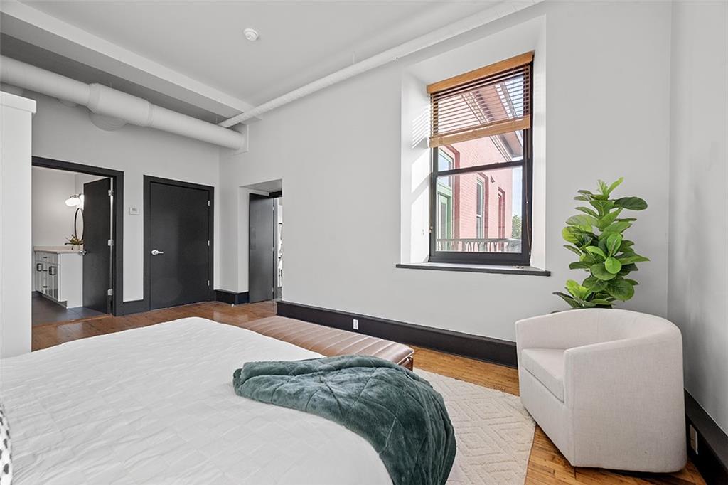 3080 Smallman Street Pittsburgh, PA 15201 - Photo 24 of 48 a bedroom with a bed and a potted plant