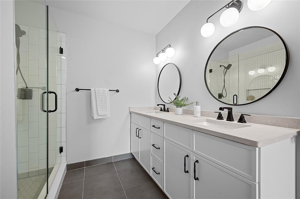 3080 Smallman Street Pittsburgh, PA 15201 - Photo 27 of 48 a bathroom with a double vanity sink and a mirror
