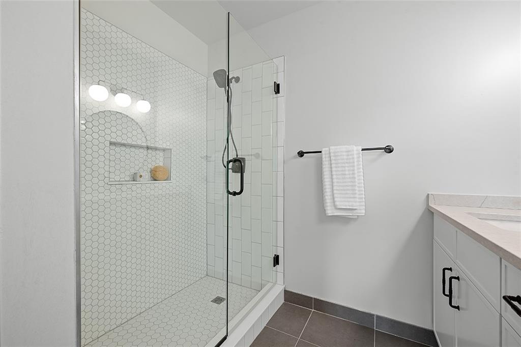 3080 Smallman Street Pittsburgh, PA 15201 - Photo 28 of 48 a bathroom with a shower and a sink