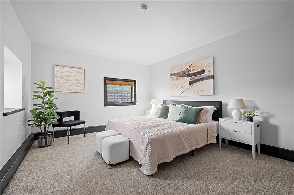 3080 Smallman Street Pittsburgh, PA 15201 - Photo 31 of 48 a spacious bedroom with a bed and a couch