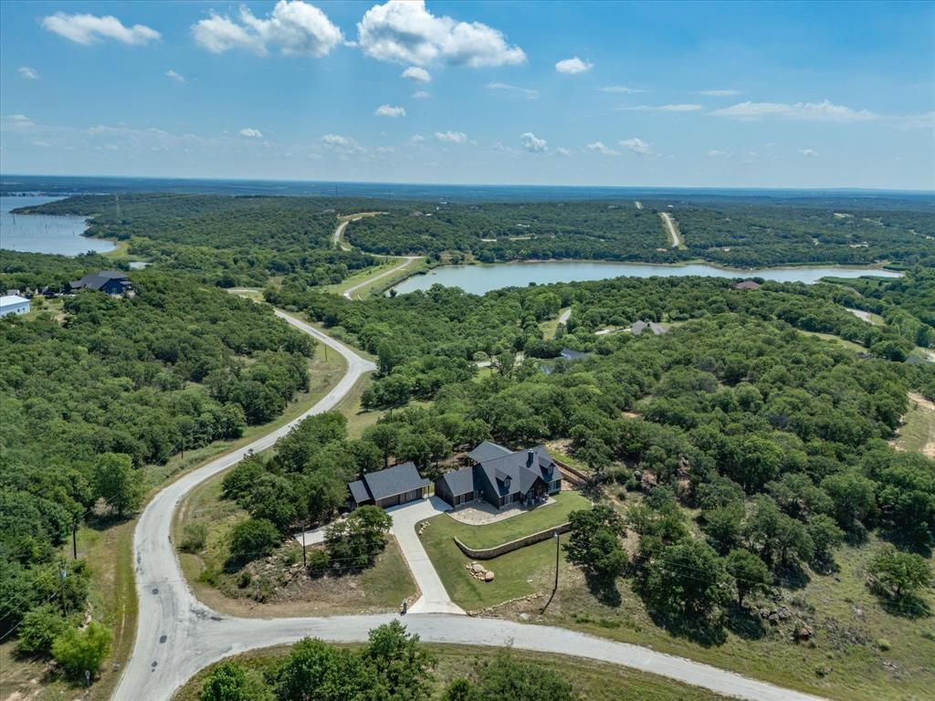 117 Ranchview Court Bowie, TX 76230 - Photo 39 of 40 an aerial view of residential houses with outdoor space and trees