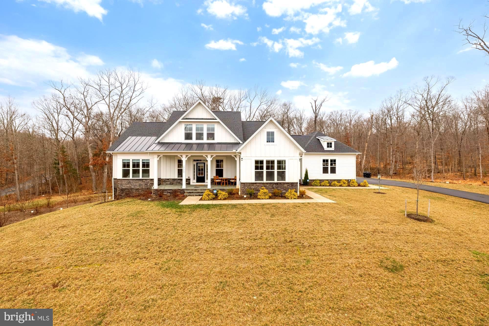 a view of house with outdoor space and swimming pool