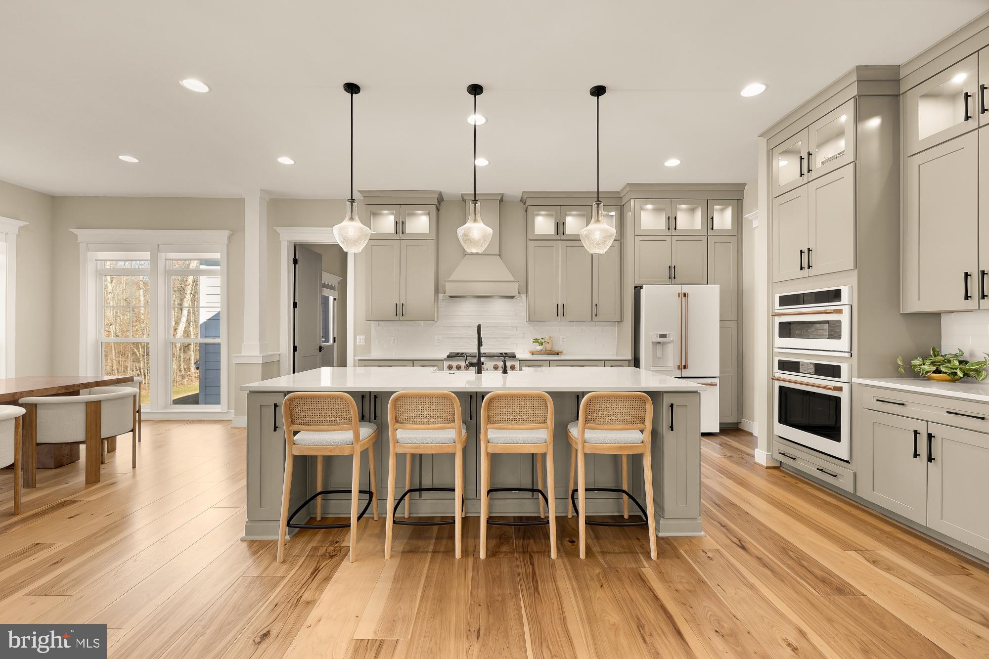 12650 Popes Head Road Clifton, VA 20124 - Photo 14 of 69 a large kitchen with a table and chairs