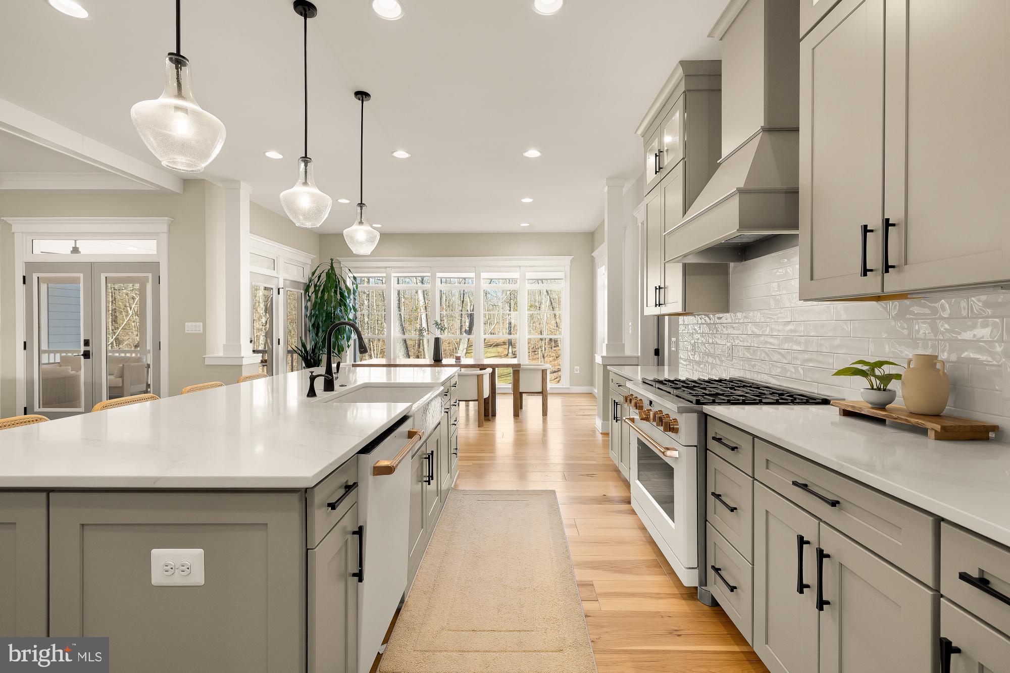 12650 Popes Head Road Clifton, VA 20124 - Photo 15 of 69 a large kitchen with stainless steel appliances lots of counter space and wooden floor