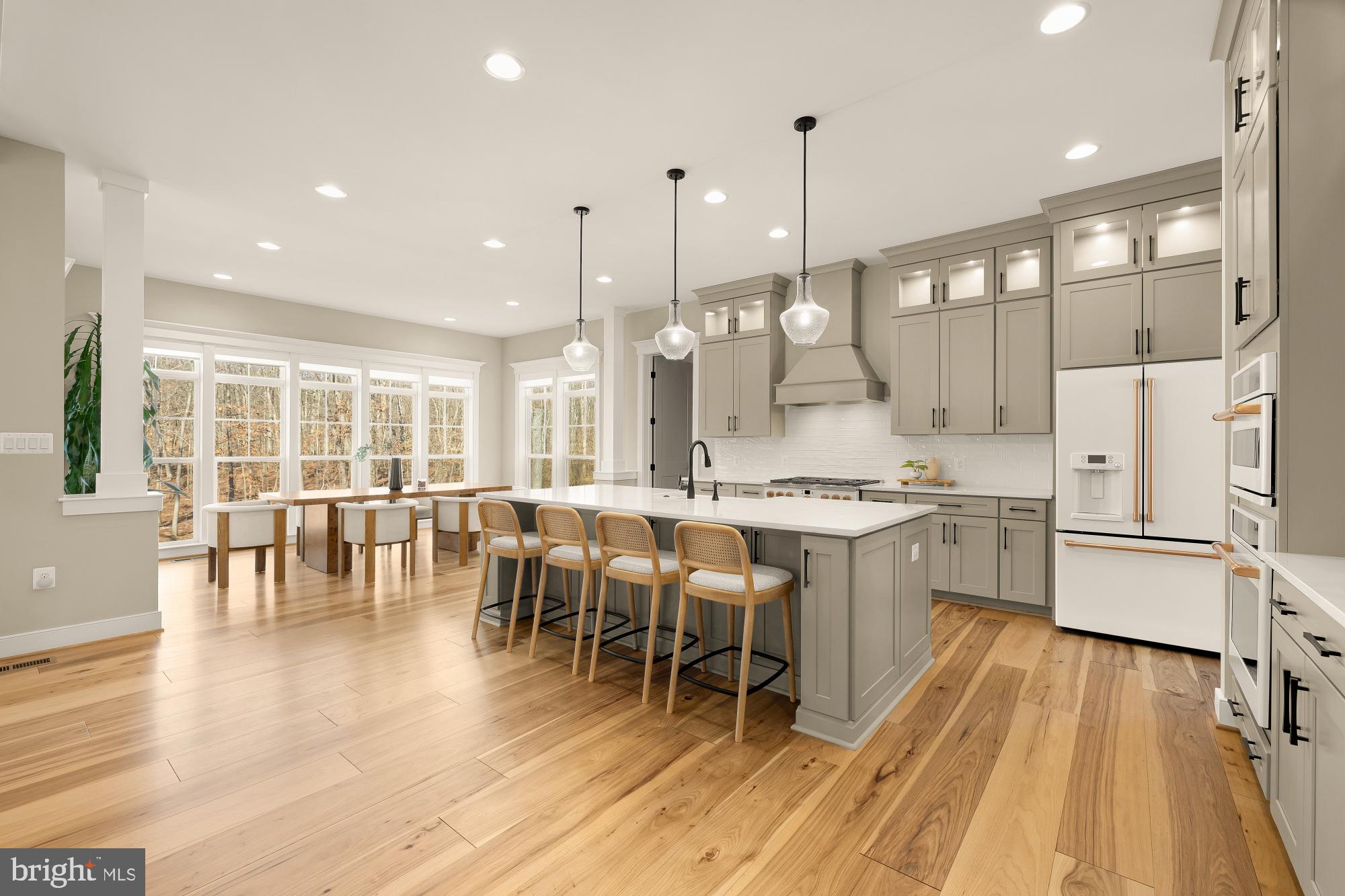 12650 Popes Head Road Clifton, VA 20124 - Photo 16 of 69 a large kitchen with lots of counter space dining table and stainless steel appliances