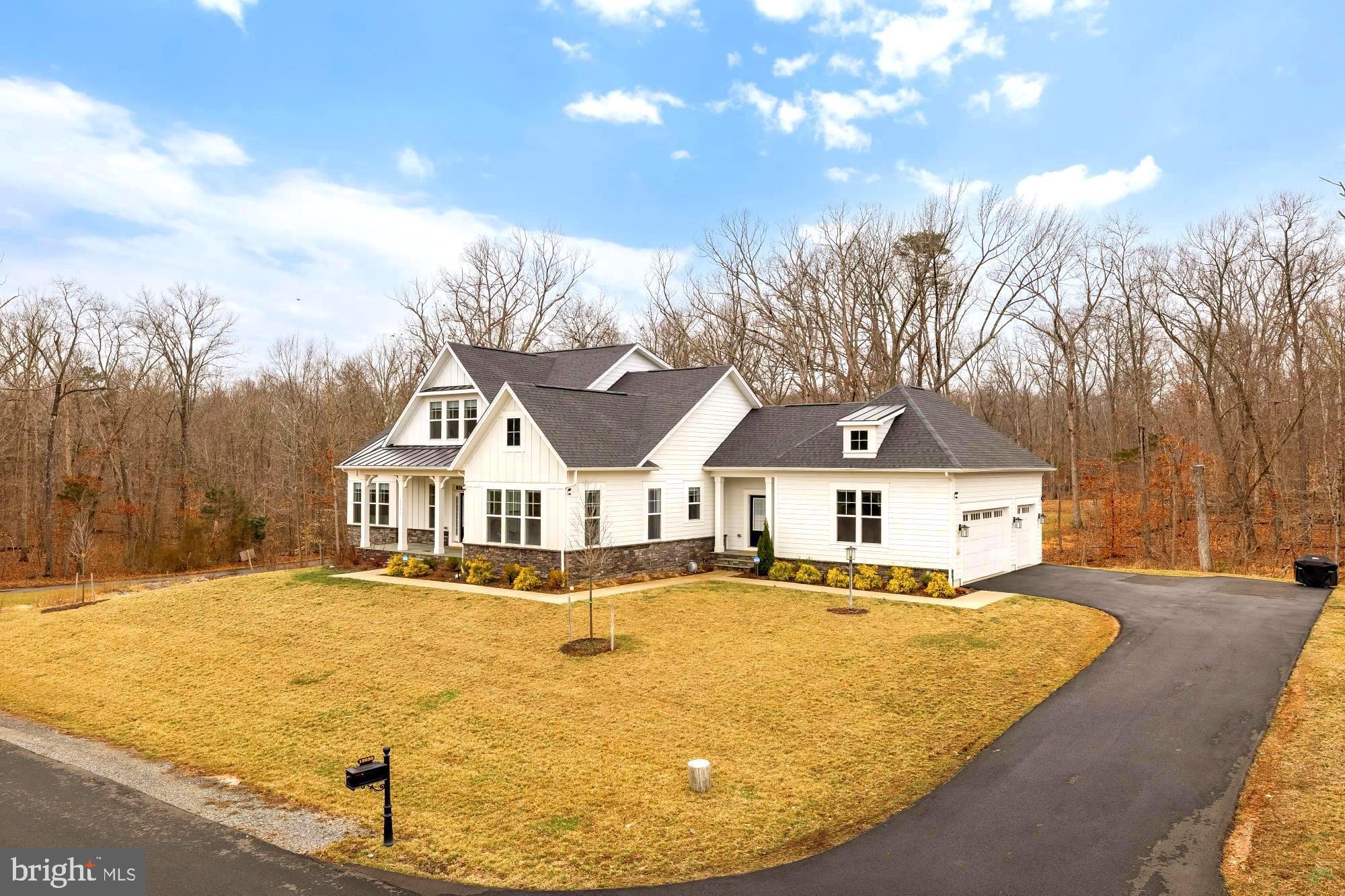 12650 Popes Head Road Clifton, VA 20124 - Photo 2 of 69 a front view of a house with a yard