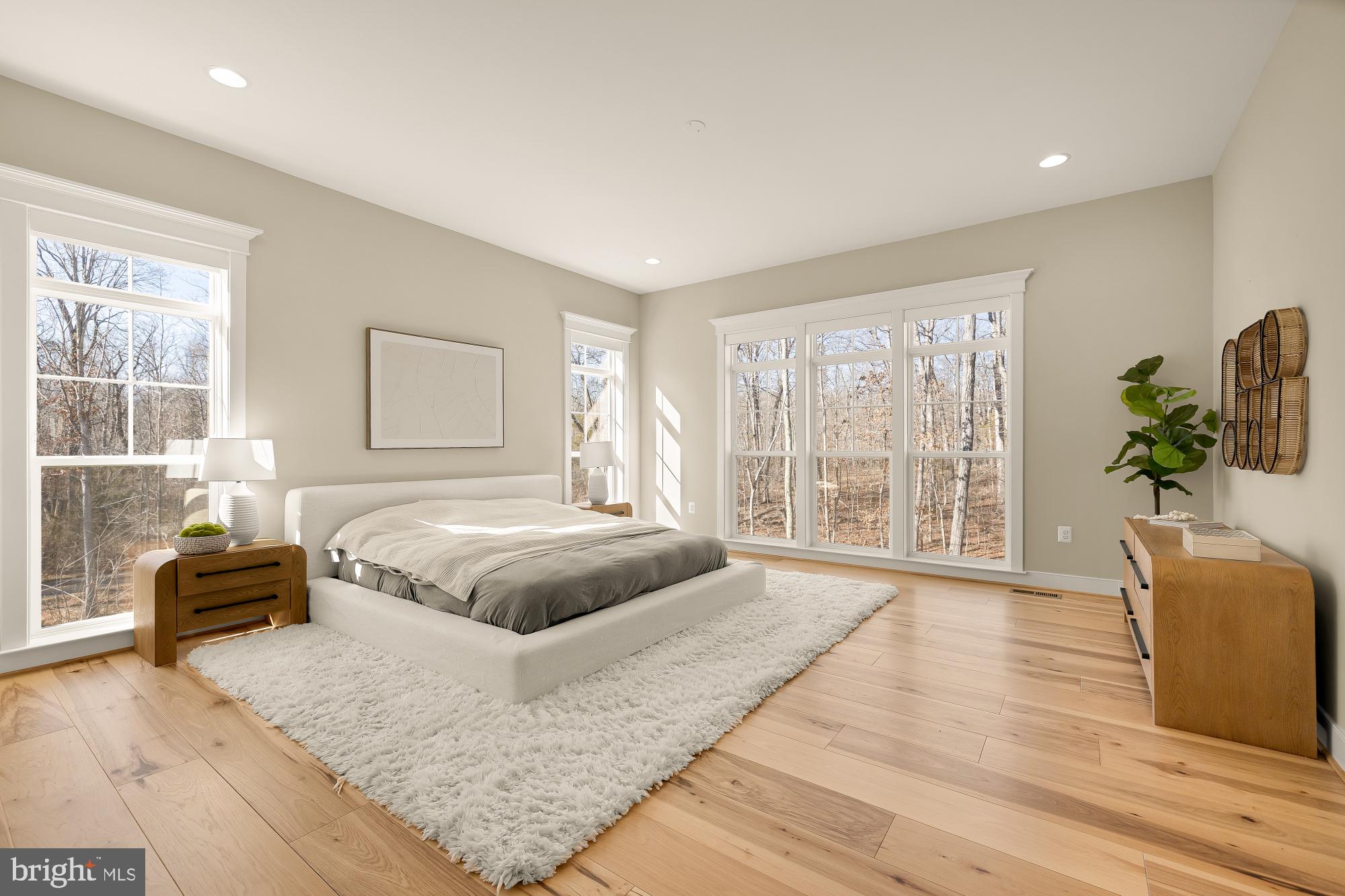 12650 Popes Head Road Clifton, VA 20124 - Photo 28 of 69 a spacious bedroom with a large bed and a couch