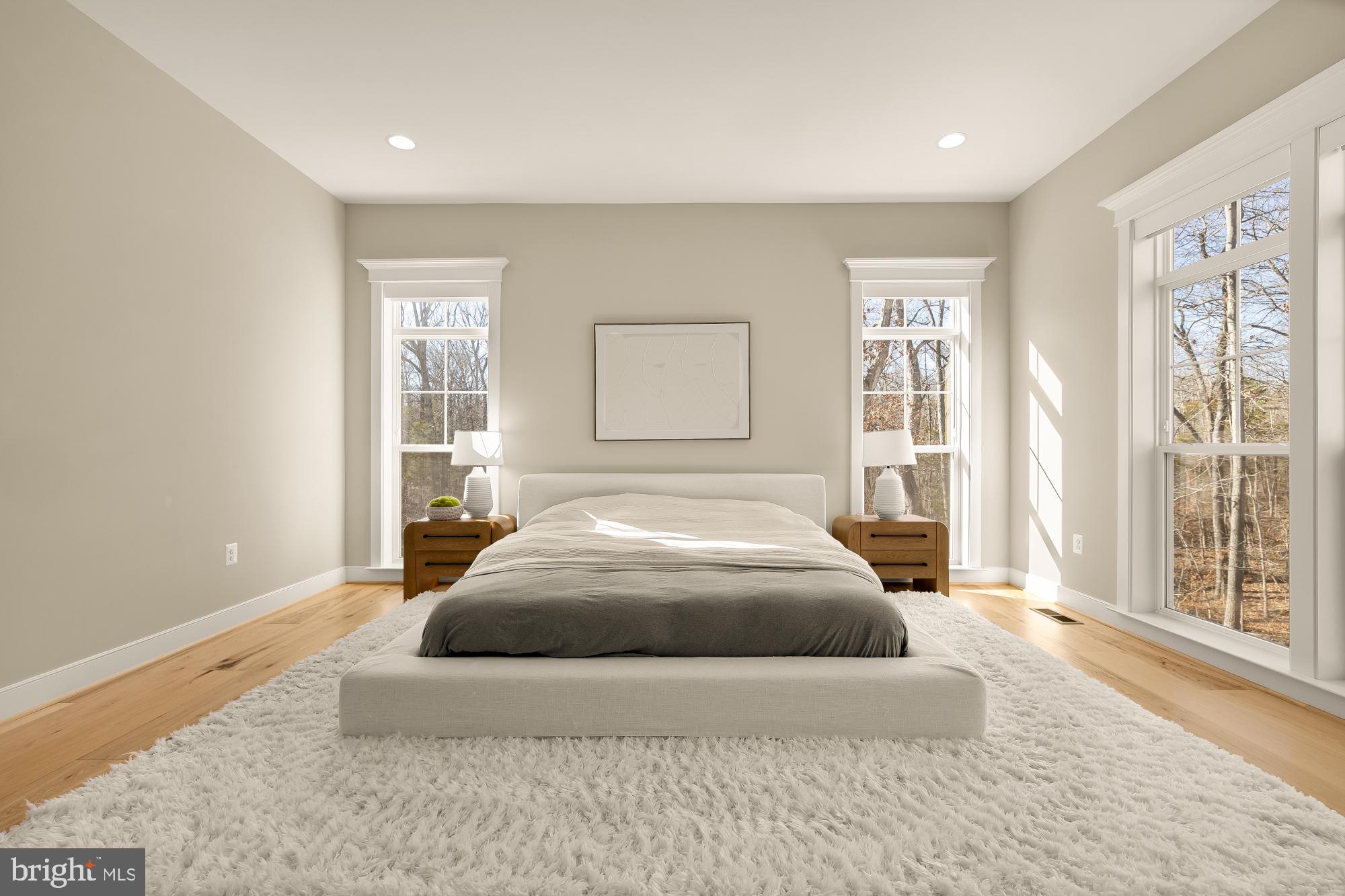 12650 Popes Head Road Clifton, VA 20124 - Photo 30 of 69 a spacious bedroom with a large bed and a large window