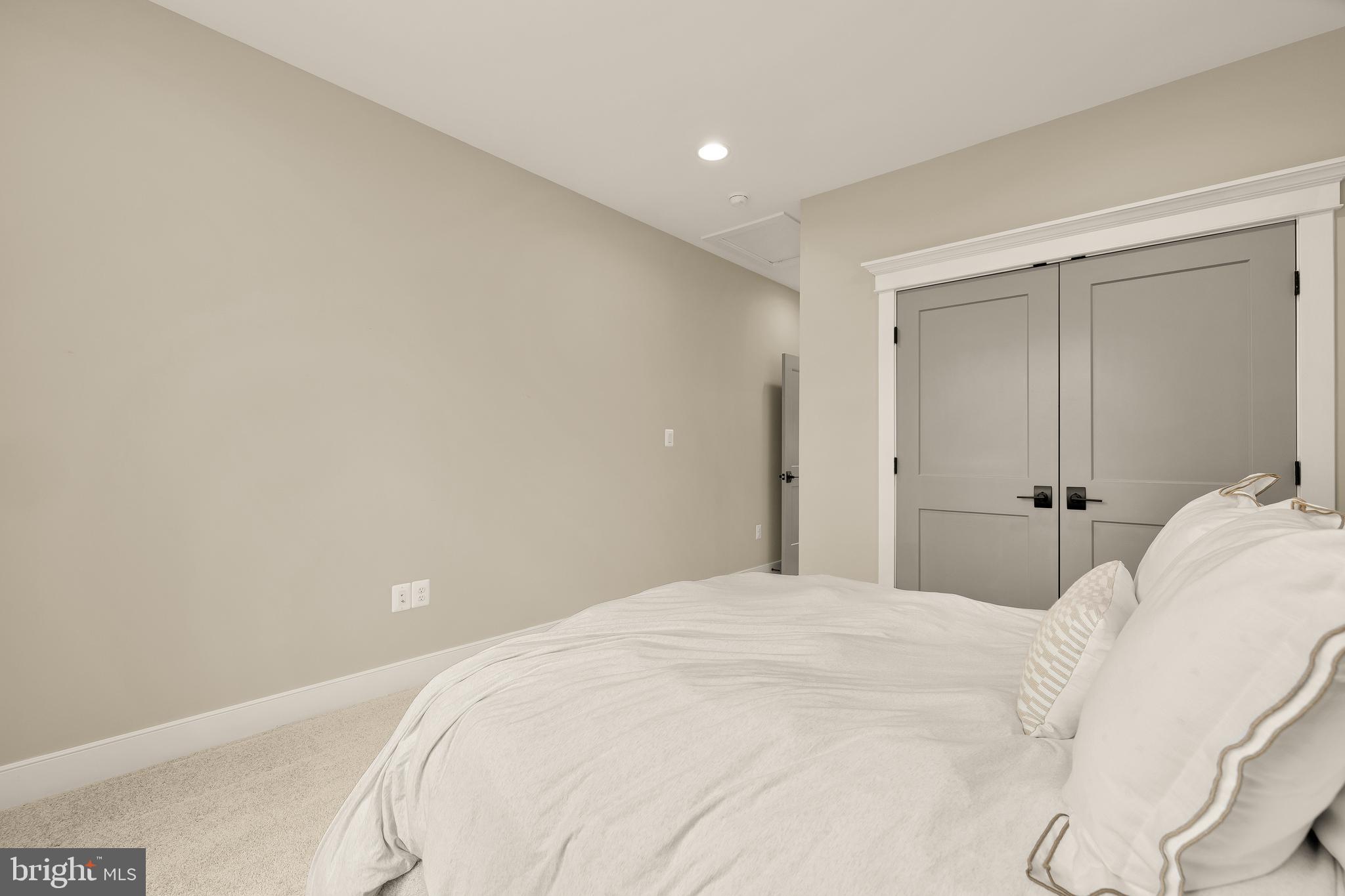 12650 Popes Head Road Clifton, VA 20124 - Photo 36 of 69 a bedroom with a bed and a lamp