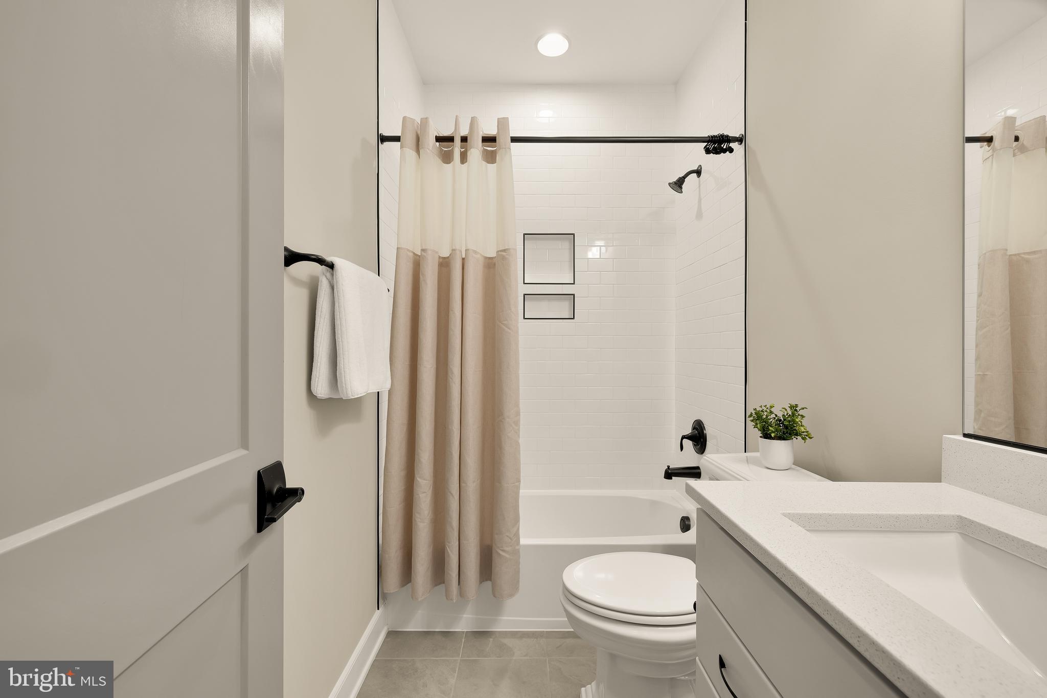 12650 Popes Head Road Clifton, VA 20124 - Photo 43 of 69 a bathroom with a granite countertop sink toilet and shower
