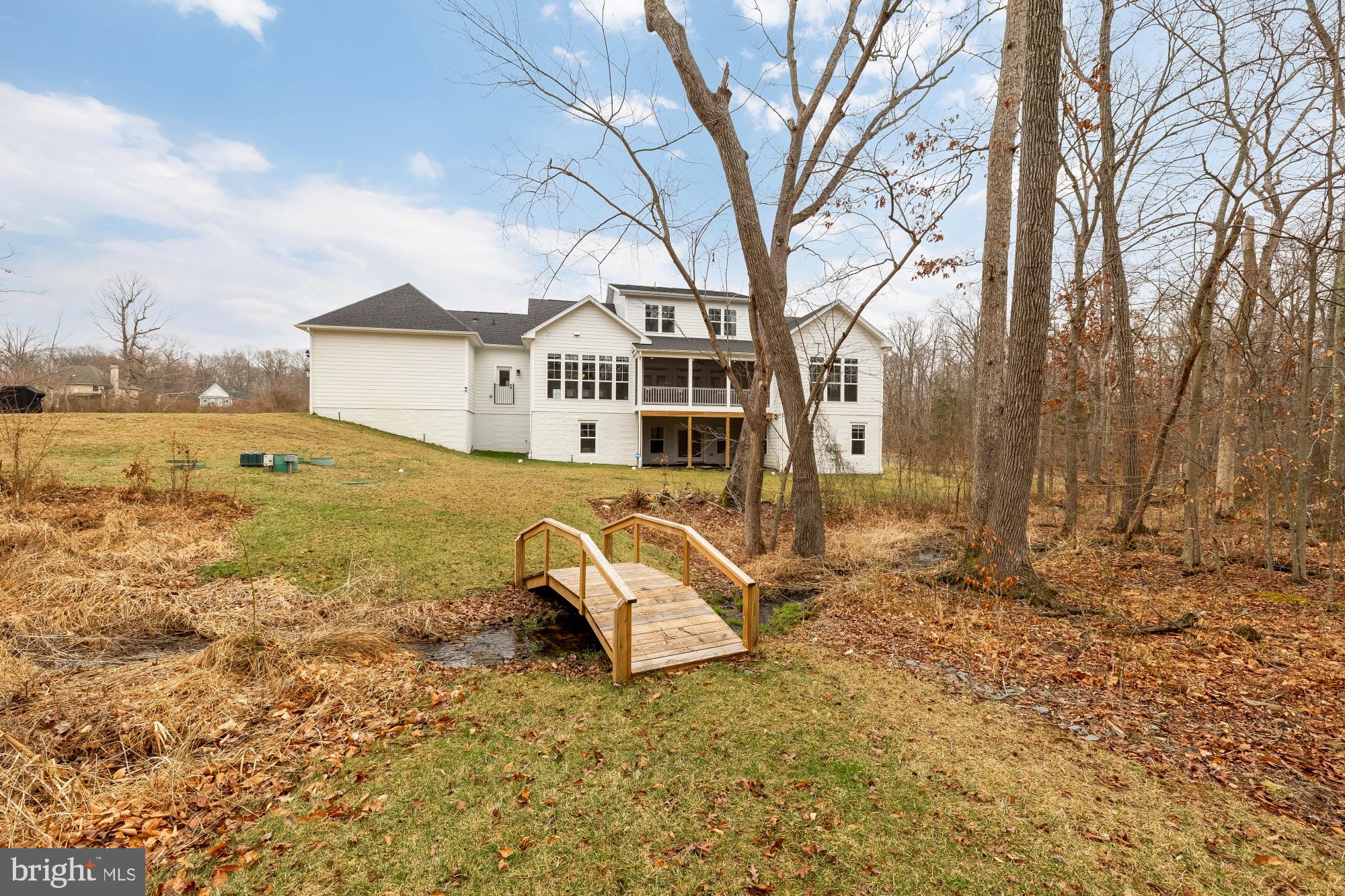 12650 Popes Head Road Clifton, VA 20124 - Photo 60 of 69 a view of a house with a yard covered with snow in the yard