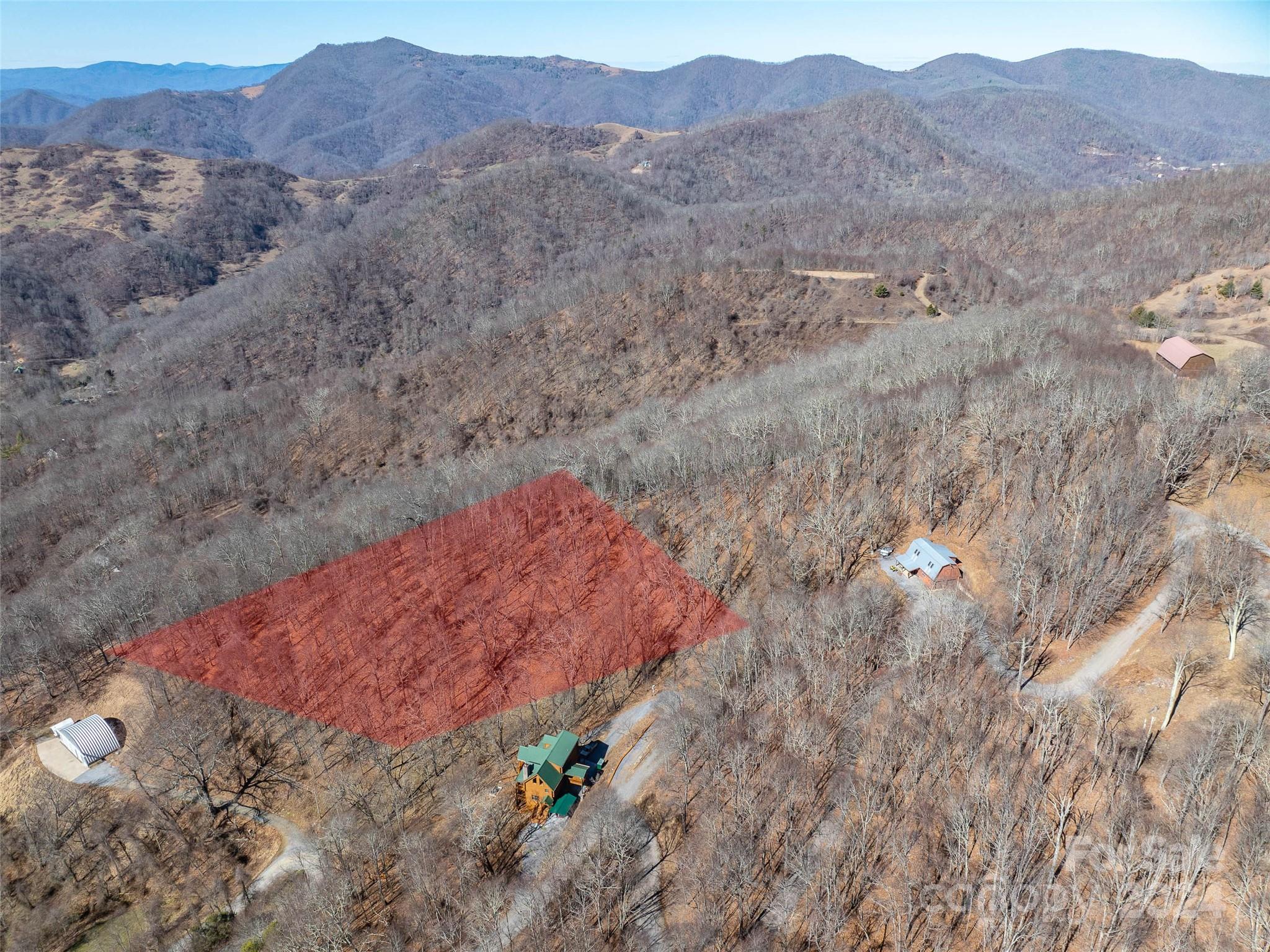 55 Rock House Cove Road Clyde, NC 28721 - Photo 2 of 10 a view of a lush green hillside and a mountain