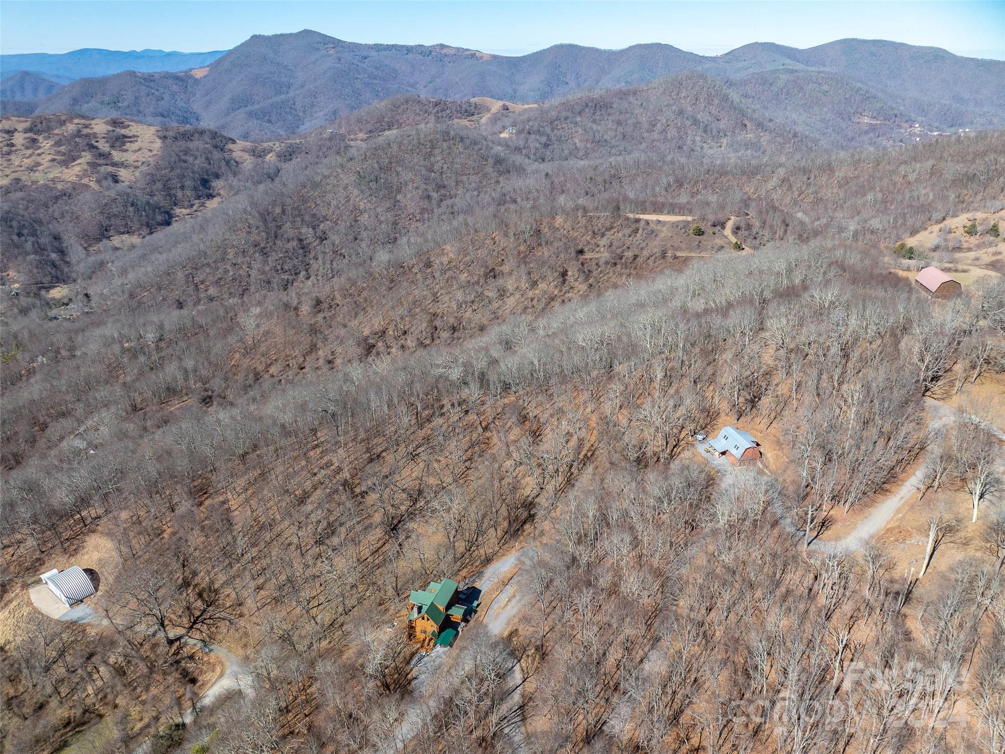 55 Rock House Cove Road Clyde, NC 28721 - Photo 6 of 10 a view of an outdoor space and mountain view