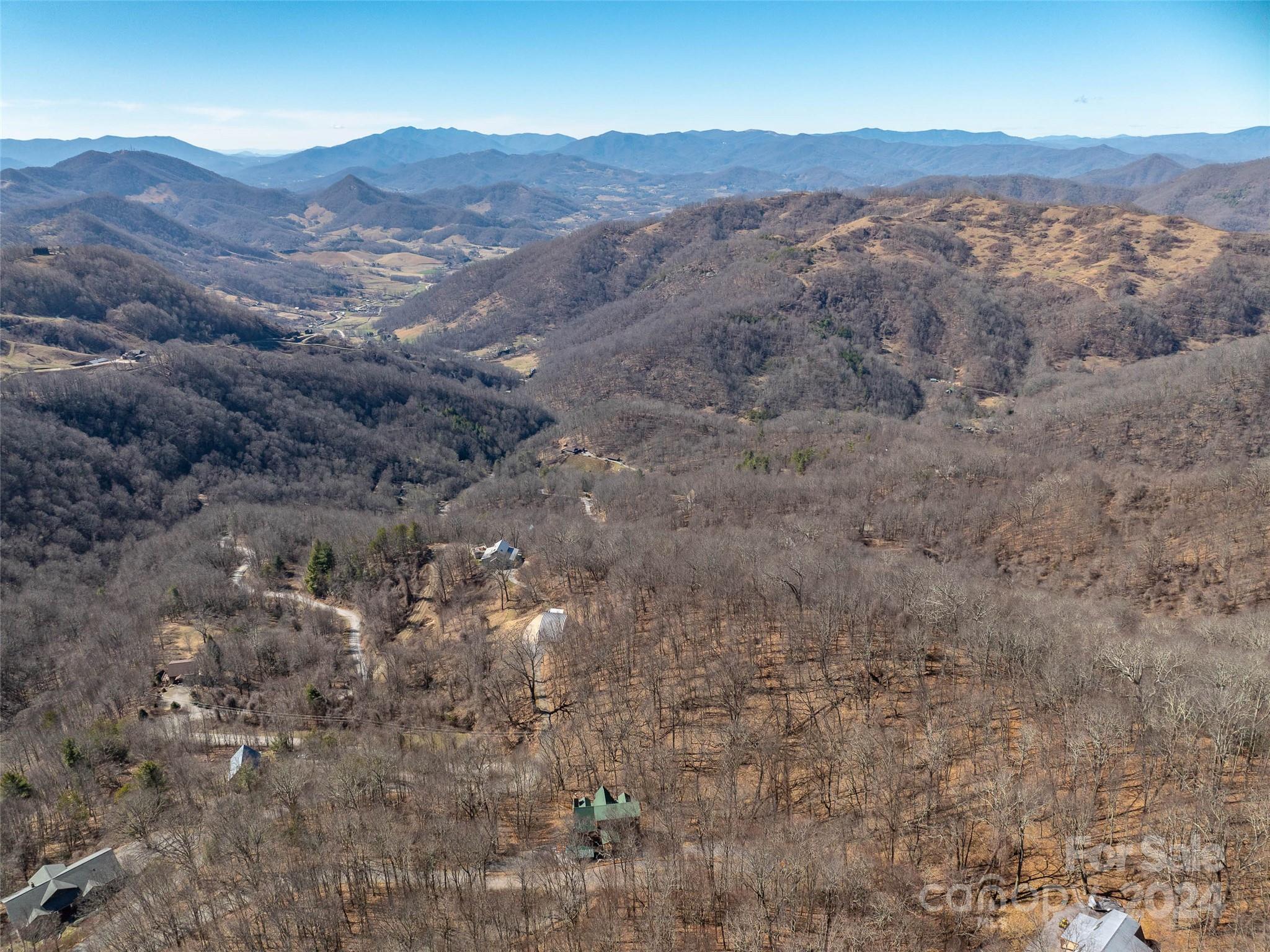 55 Rock House Cove Road Clyde, NC 28721 - Photo 7 of 10 a view of a mountain in the distance