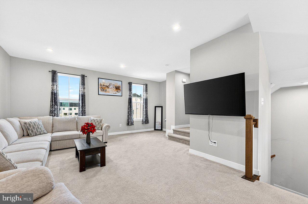 39 Sage Way Mount Laurel, NJ 08054 - Photo 12 of 32 a living room with furniture and a flat screen tv